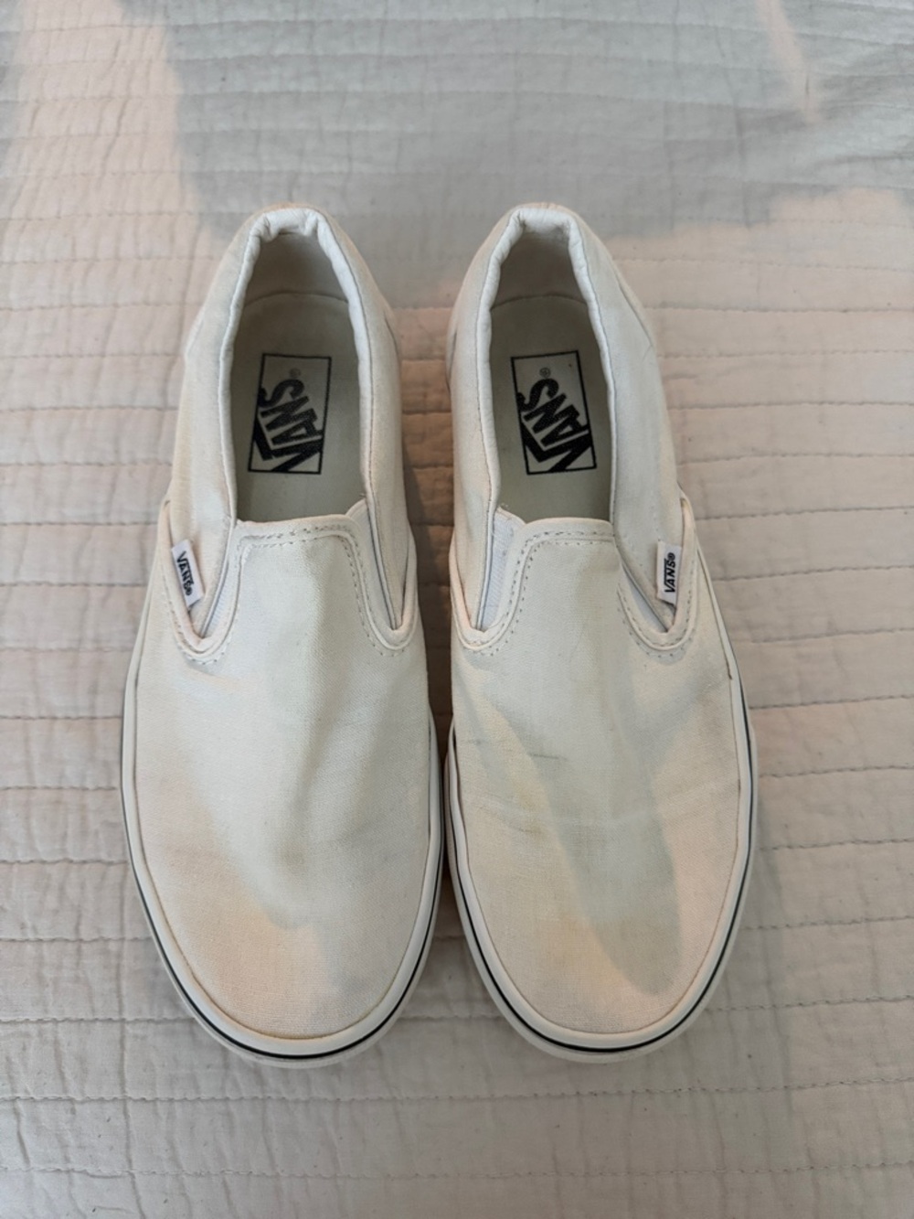 Vans Slip-On Canvas Sneakers in Cream and Black Trim